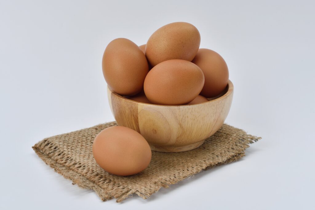 A bowl filled with brown eggs